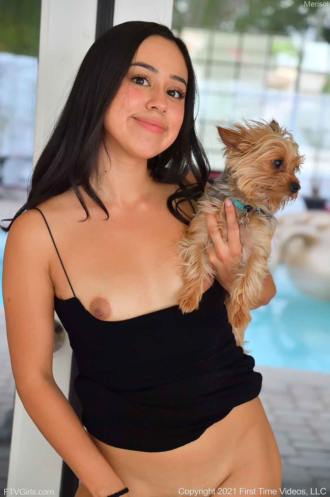 Merisol FTV cutely smile and is showing her small tits while holding a small furry puppy on her hands